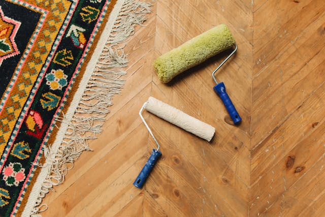 Paint rollers on wood floor