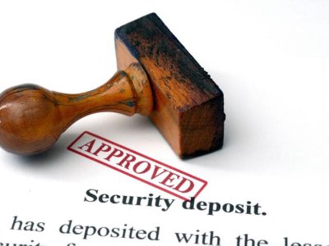wooden-stamp-marked-approved-on-a-document-labeled-security-deposit